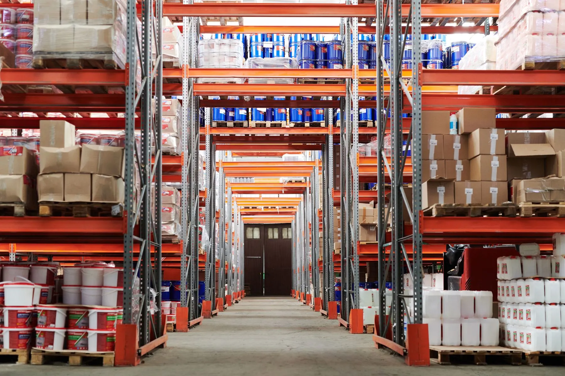 Bright parts warehouse with organised shelving